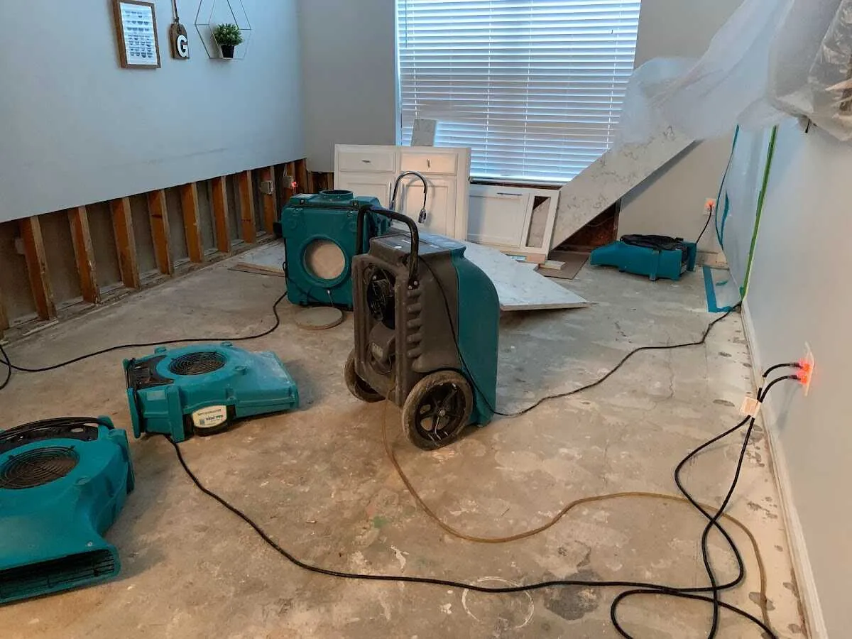 Dehumidifier in flood-cut room for Water Damage Restoration in Denison